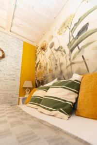 A bed or beds in a room at Vidéki Porta