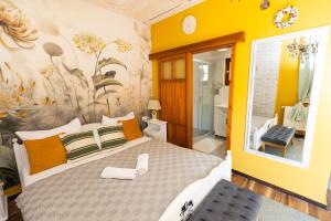 A bed or beds in a room at Vidéki Porta