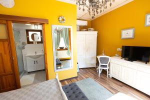 A bed or beds in a room at Vidéki Porta