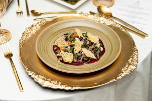 a plate of food on top of a table at Holiday Inn Abu Dhabi by IHG in Abu Dhabi