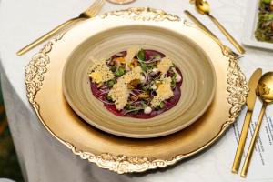 a bowl of food on top of a table at Holiday Inn Abu Dhabi by IHG in Abu Dhabi