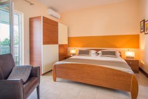 מיטה או מיטות בחדר ב-Villa Palma