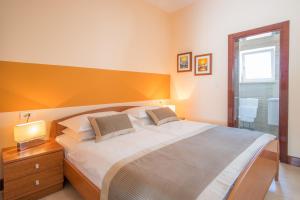 Postel nebo postele na pokoji v ubytování Villa Palma