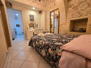 Postel nebo postele na pokoji v ubytování Charming rustic getaway in Xaghra, Gozo.