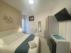 Ein Bett oder Betten in einem Zimmer der Unterkunft Hotel Lorenza B&B e Mini Suite