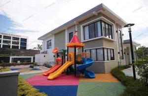 a house with a playground in front of it at Kzl Crib in Davao City