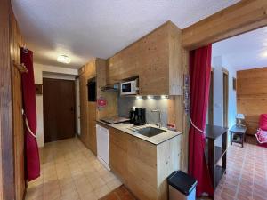 a kitchen with a sink and a counter top at Appartement 6 pers, proche pistes et commerces, Crest-Voland - FR-1-733-8 in Crest-Voland +8 photos