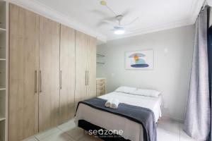 Ένα ή περισσότερα κρεβάτια σε δωμάτιο στο Apto 3 Quartos a 190m da Praia EPP0602
