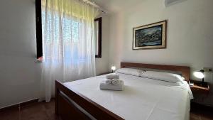 Postel nebo postele na pokoji v ubytování CASA PISCINA Fois + 22 fotografií