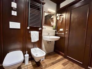 a bathroom with a toilet and a sink at Elle Palace - Simply Elegant in Verona +67 photos