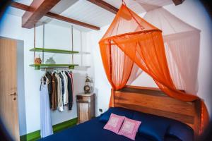 En eller flere senge i et værelse på Le Radici Casa Vacanze