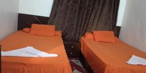 A bed or beds in a room at Dara guest House