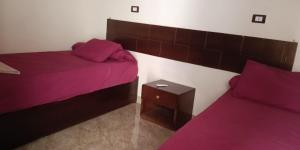 A bed or beds in a room at Dara guest House