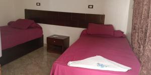 A bed or beds in a room at Dara guest House