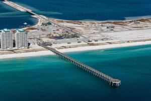 an aerial view of a bridge over the ocean at Peachy Queen by Gulf Coast Getaways in Navarre