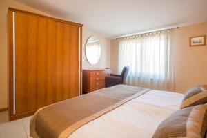 Postel nebo postele na pokoji v ubytování Villa Palma