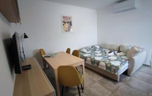 a living room with a couch and a table at Bellavista Resort in Koper