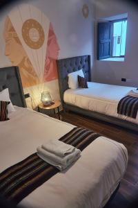 Postel nebo postele na pokoji v ubytování Way Kap Hostel Cusco
