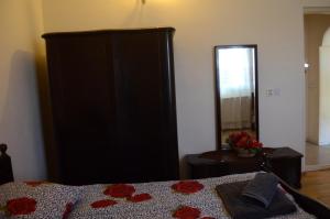 Ein Bett oder Betten in einem Zimmer der Unterkunft Alex's Cosy Guesthouse