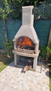 a stone oven with a fire inside of it at Casa Alba Paestum in Paestum