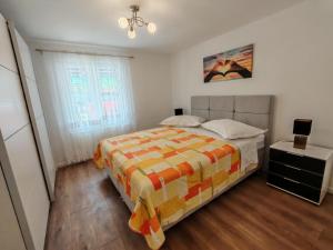a bedroom with a bed and a window at Apartments MajaPaula in Slatine +26 photos