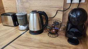 a coffee maker and a blender sitting on a counter at Four Suns Loft in Thessaloniki