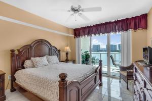 a bedroom with a bed and a large window at Bay View Oasis with Balcony & Free Parking Sunny Isles Beach in Sunny Isles Beach