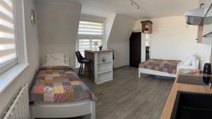 En eller flere senger på et rom på Apartmán Kaiser