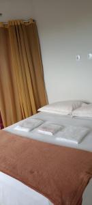 En eller flere senge i et værelse på Suíte em cobertura próximo praia Da Barra do Jucu + 26 billeder