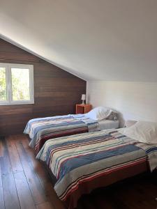 Postel nebo postele na pokoji v ubytování Le Village tropical avec sa villa et ses 6 bungalows + 14 fotografií