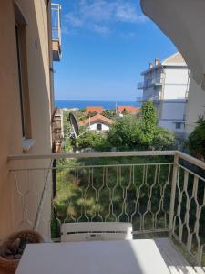 a balcony with a view of the ocean at CadiLina in Ceriale