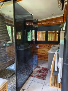 a bathroom with a sink and a mirror at Windsong Living The Nest in Krugersdorp