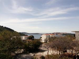 a view of the water from a hill at Studio Apartment in Rogoznica