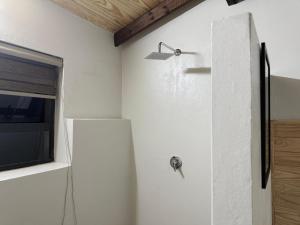 a kitchen with a refrigerator and a window at The Mills in Warden