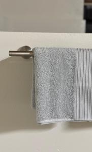 a towel hanging on a towel rack with a spoon at The Mills in Warden