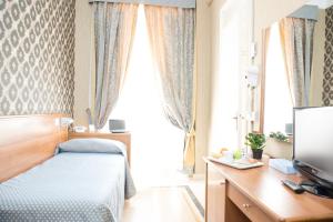 Postel nebo postele na pokoji v ubytování Hotel Emmaus