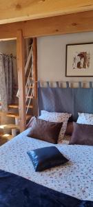 a bedroom with two beds and a staircase at Les Châtaigniers Gîtes du Mas Haut in Saint-Jean-du-Gard