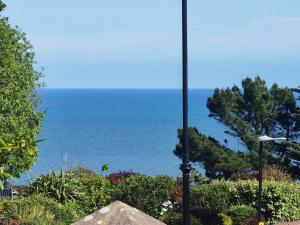 a street light with the ocean in the background at Seaside studio for business or holiday travellers in Eastbourne +6 photos