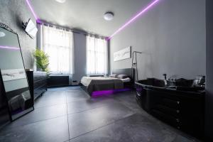Postel nebo postele na pokoji v ubytování Wellness Rooms Central