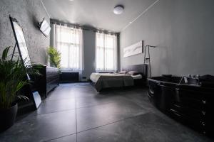Postel nebo postele na pokoji v ubytování Wellness Rooms Central