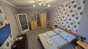 Postel nebo postele na pokoji v ubytování Dóra apartman best location
