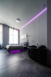 Postel nebo postele na pokoji v ubytování Wellness Rooms Central