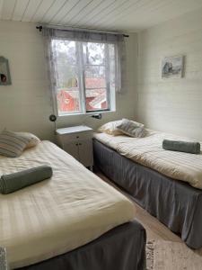 Postel nebo postele na pokoji v ubytování Ingmarsö B&B