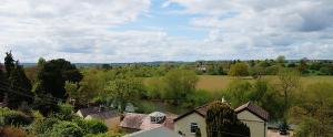 an aerial view of a village with a river at Radcliffe Guest House in Ross on Wye