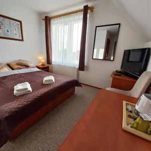 Postel nebo postele na pokoji v ubytování Akwen