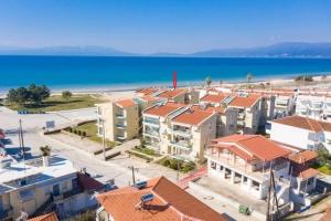 arial view of a city and the beach at Paralia Ofriniou Sea view apartment in Orfánion