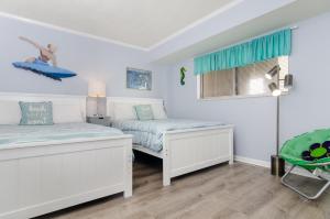 Voodi või voodid majutusasutuse Paradise by Bryant Real Estate toas +20 fotot