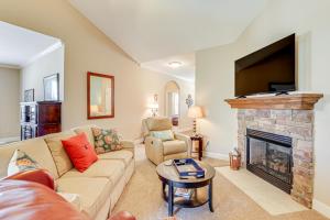 a living room with a couch and a fireplace at Stay at Jos Taylor Retreat 9 Mi to Greenville! in Taylors