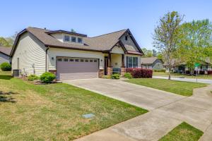 a house with a garage and a driveway at Stay at Jos Taylor Retreat 9 Mi to Greenville! in Taylors