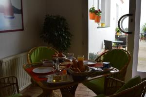 a table with a plate of food on it at Hotel Nou Estrelles in Cadaqués